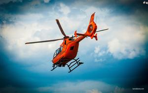 An awesome shot of a red rescue helicopter